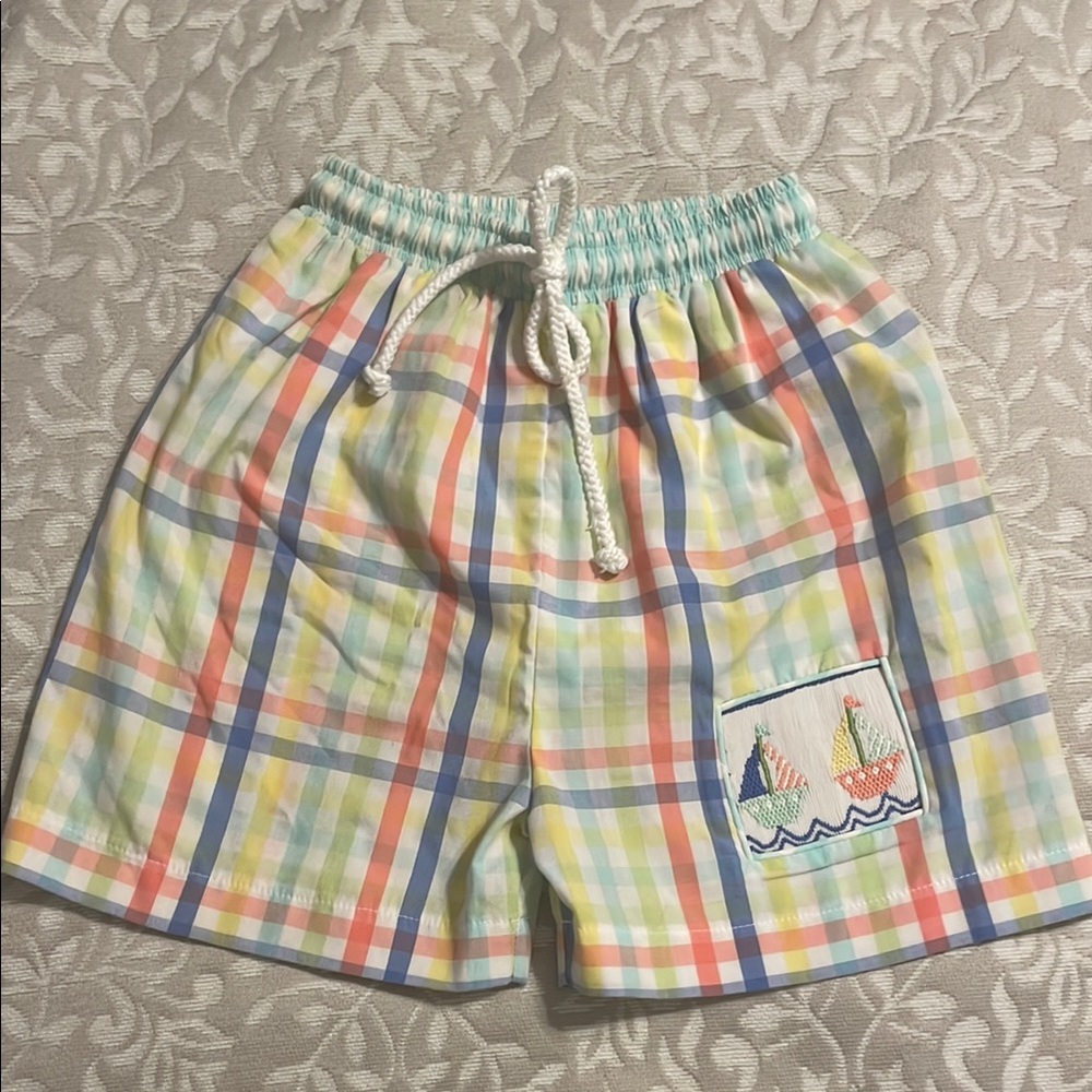 Shrimp and Grits swim trunks with smocked sailboat.